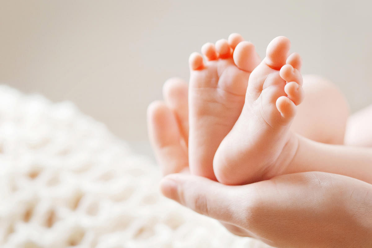 Baby feet in mother hands