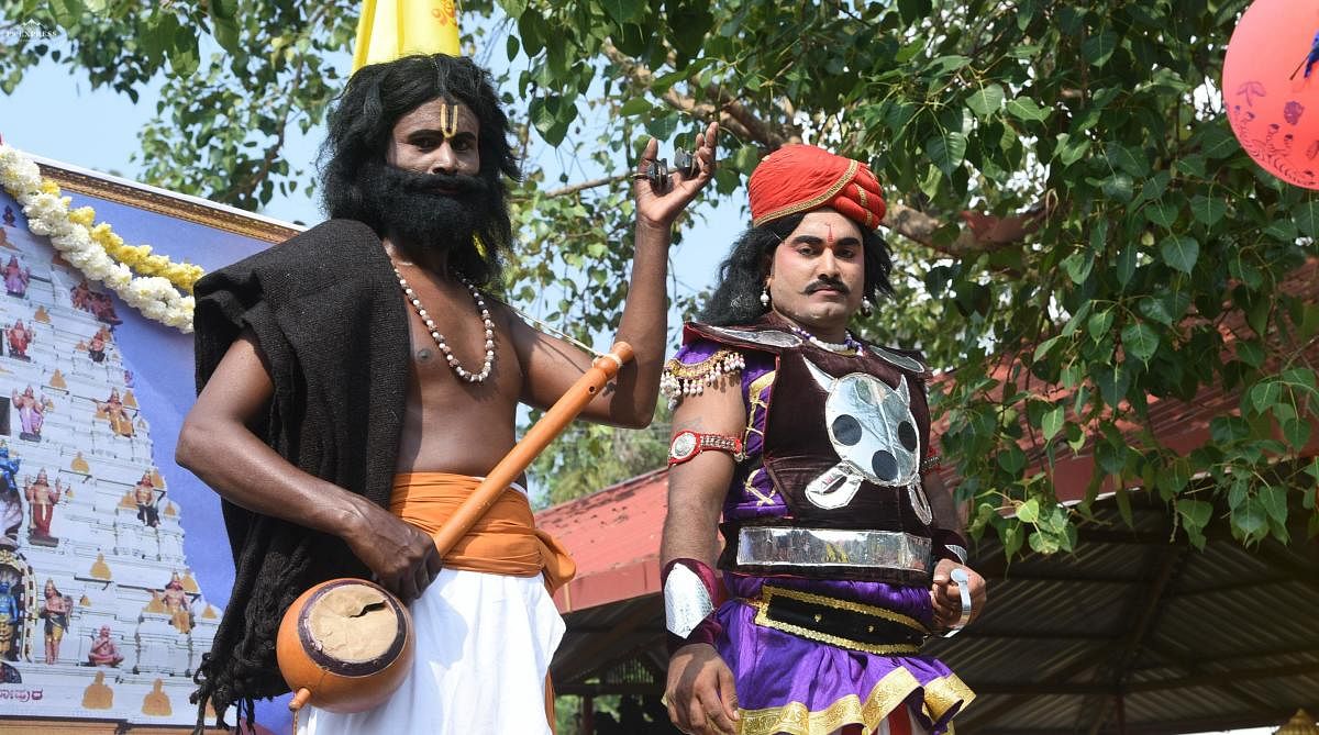 A man dressed as saint-poet Kanakadasa takes part in a procession during Kanaka Jayanti celebrations in Mangaluru.