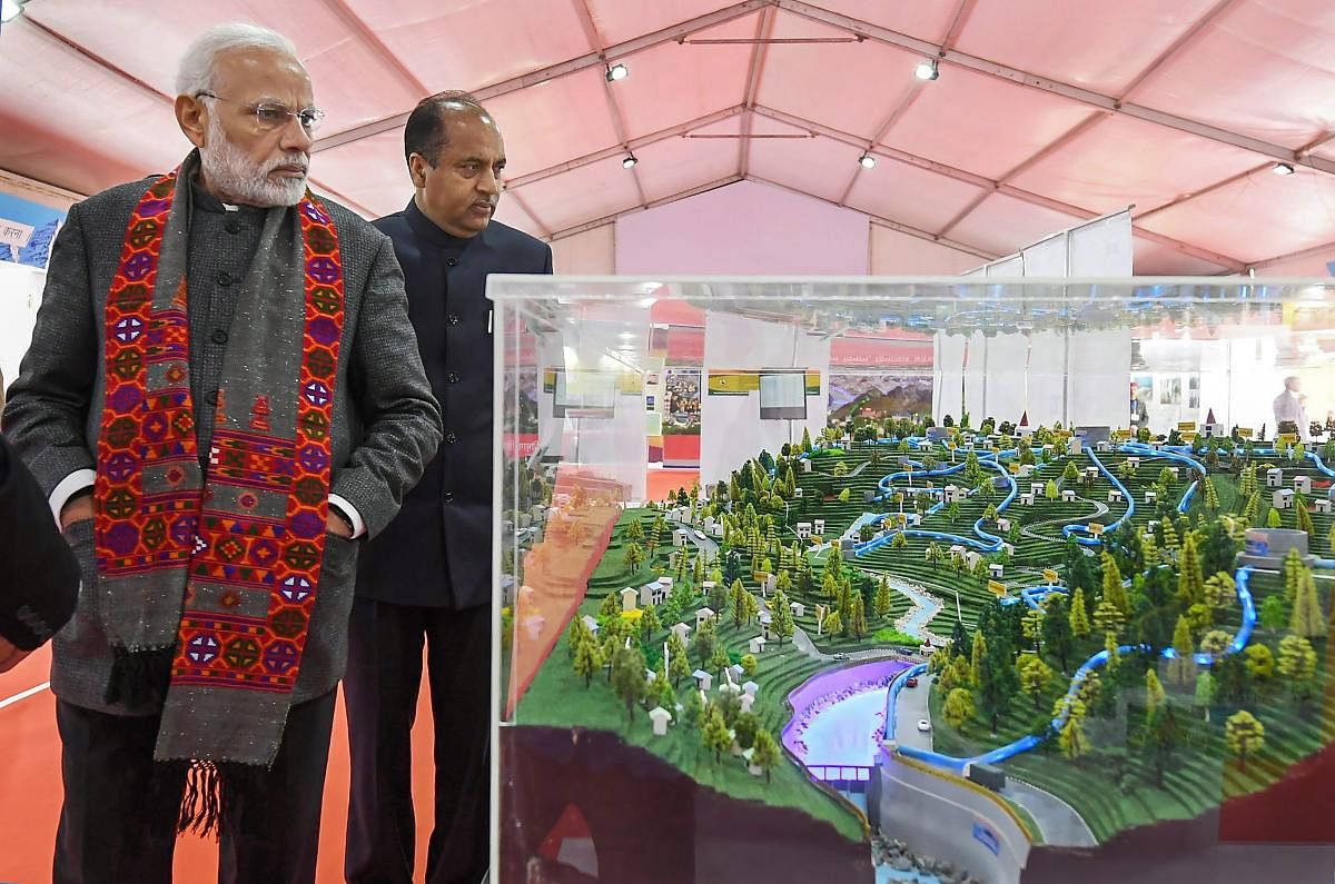 Prime Minister Narendra Modi along with Chief Minister Jai Ram Thakur visits an exhibition at Dharamshala in Himachal Pradesh. (PIB Photo via PTI)