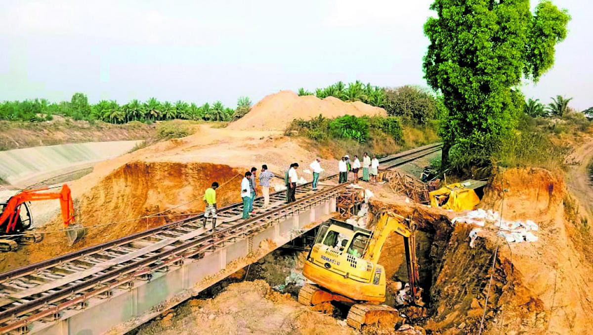 Earthmovers were pressed into service to clear landslideon the rail track near Tarikere in Chikkamagaluru district onFriday.