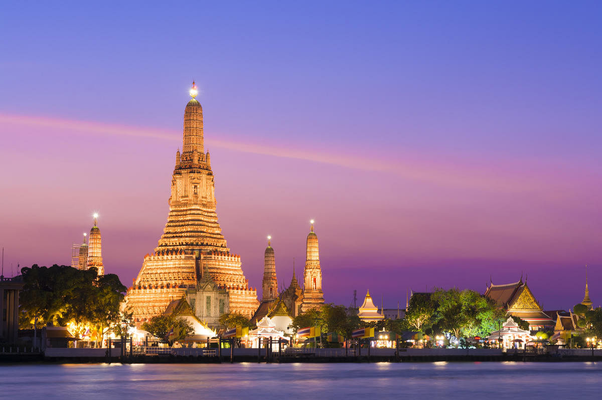 The illuminated temple of Wat Arun on the Chao Phraya river, Bangkok, Thailand