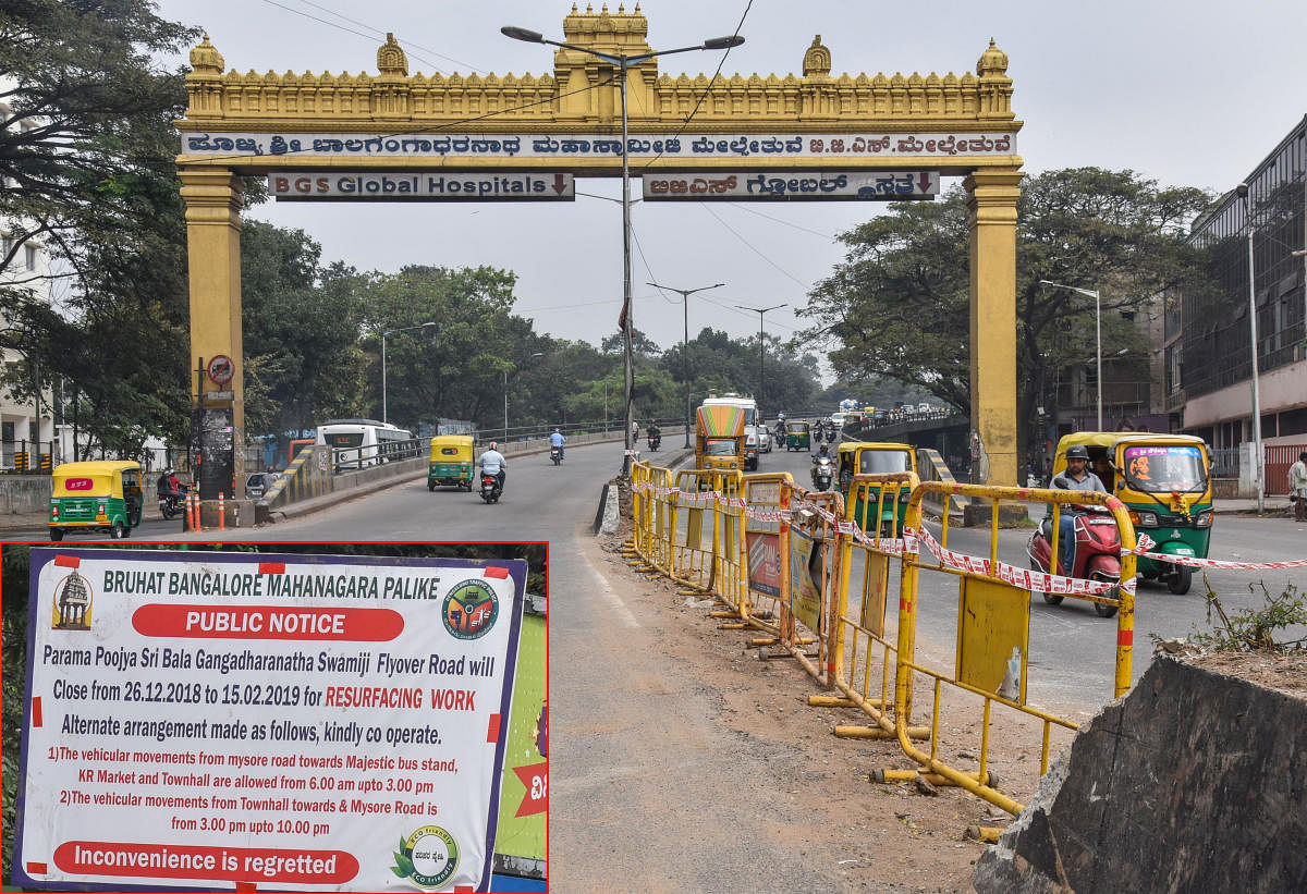The BBMP has removed the road divider and put barricades on the Sirsi Circle flyover to facilitate the resurfacing work on Saturday. dh Photo/S K Dinesh