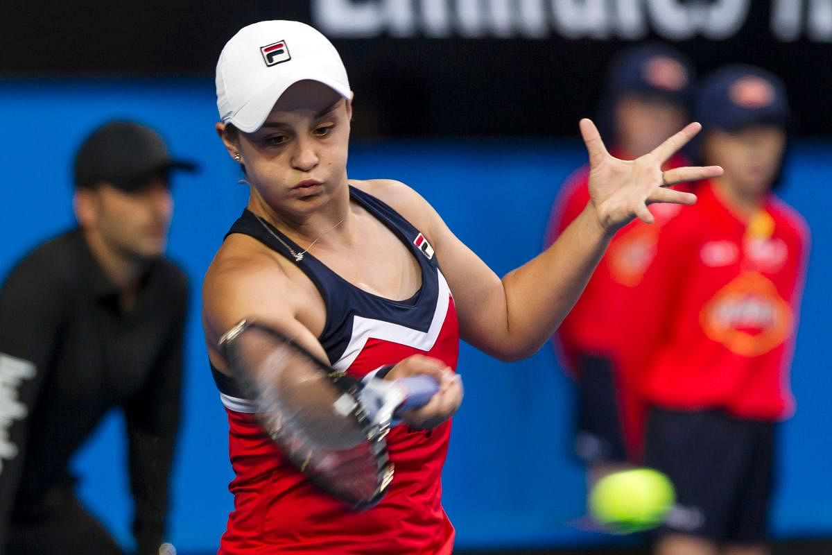 Australia’s Ashleigh Barty returns to Alize Cornet of France during their women’s singles match on Saturday. AFP