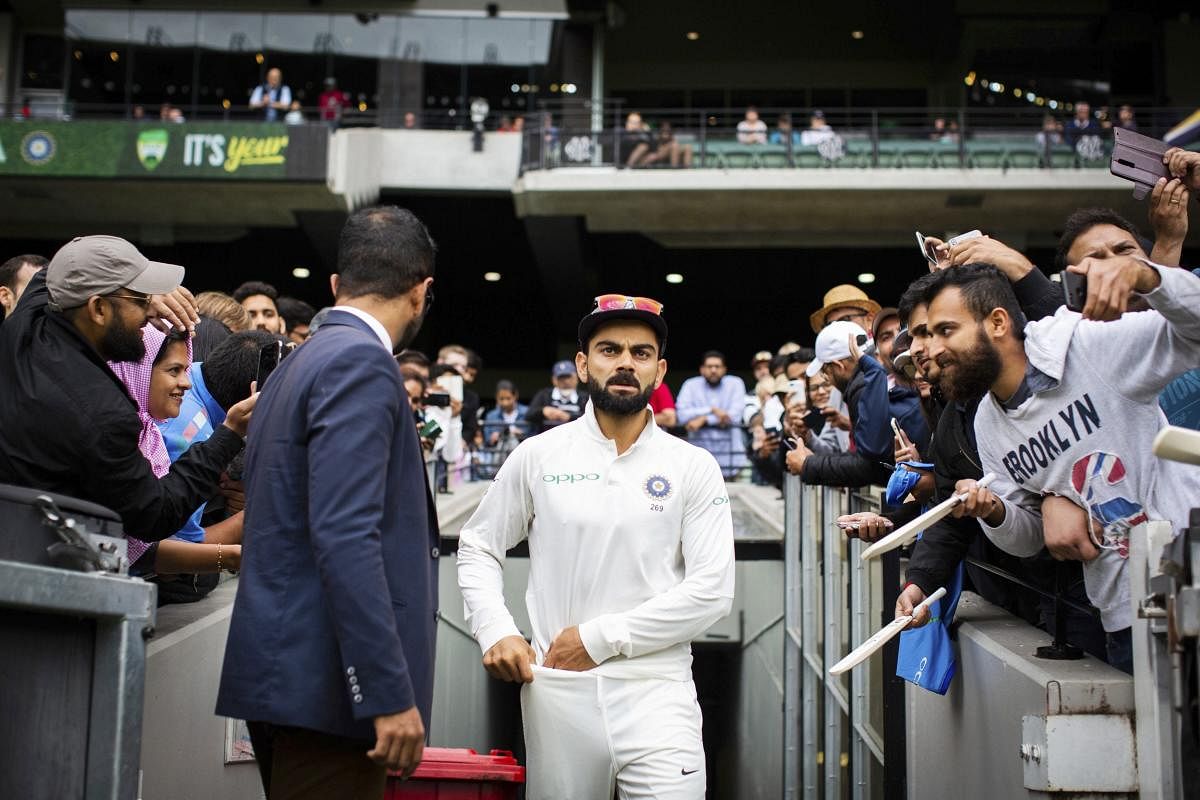 Melbourne : India's captain Virat Kohli walks up the player race during play on day five of the third cricket test between India and Australia in Melbourne, Australia, Sunday, Dec. 30, 2018. AP/PTI