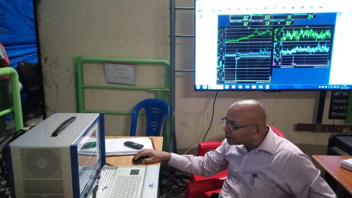 Prof Chandra Kishen analyses the strain display to check the strengh of the crossbeam at his lab in Indian Institute of Science on Sunday.