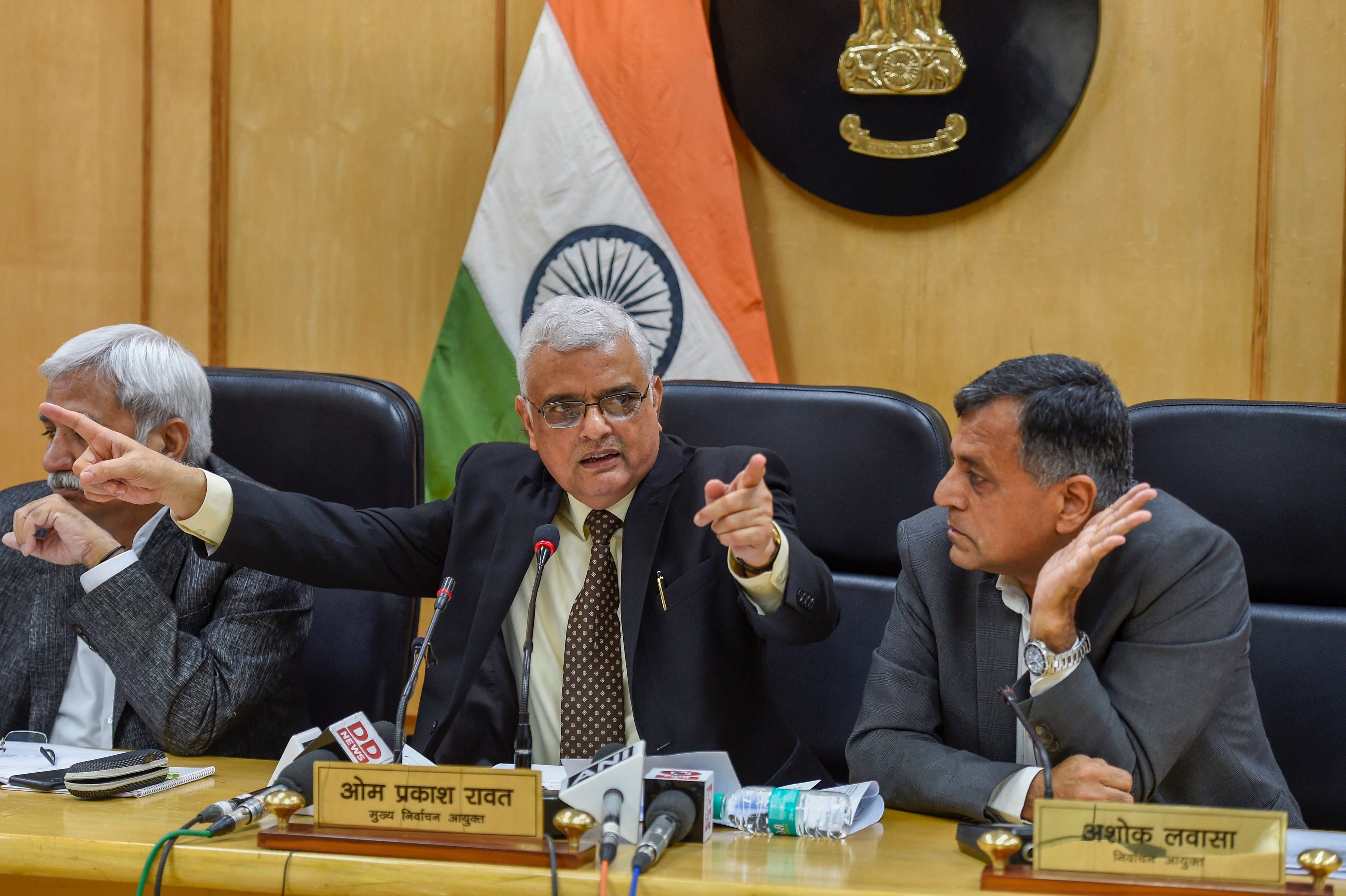 Chief Election Commissioner OP Rawat flanked by Election Commissioners Sunil Arora (L) and Ashok Lavasa (R) address a press conference to announce the dates for Assembly elections in five states, in Delhi, on Saturday. PTI