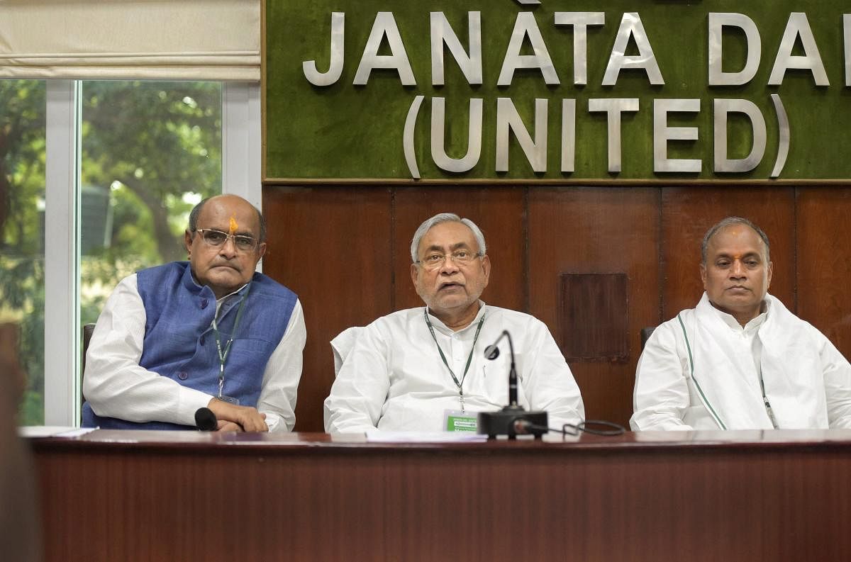 Bihar Chief Minister and JDU Chief Nitish Kumar, General Secretary K C Tyagi (L) and General Secretary (Organisation), RCP Singh during National Executive meeting at party headquarters in New Delhi on Sunday. (PTI Photo)