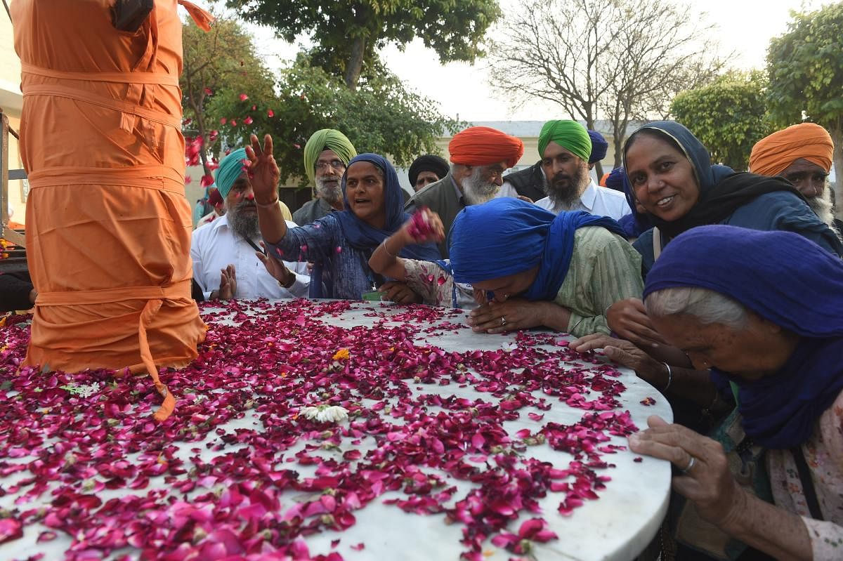 Sikh Pilgrims gather in the Kartarpur Gurdwara Sahib after a groundbreaking ceremony for the Kartarpur Corridor in Kartarpur on November 28, 2018. AFP file photo