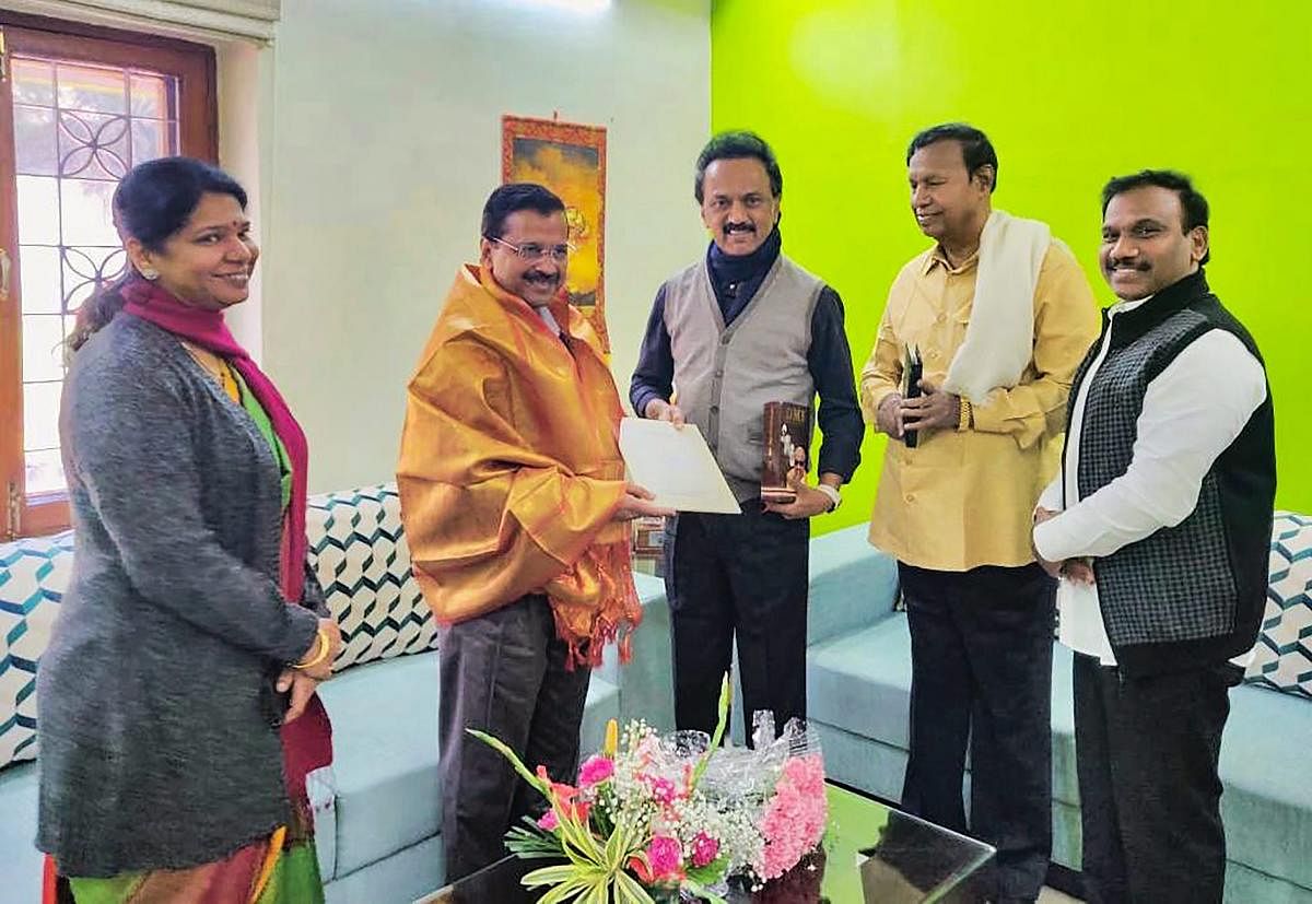 DMK president M K Stalin invites Delhi Chief Minister Arvind Kejriwal for the inauguration ceremony of the statue of M Karunanidhi in Chennai on Monday. DMK party leaders M K Kanimozhi, A Raja and T R Balu are also seen. PTI