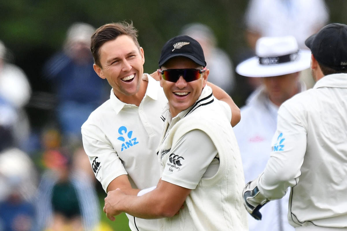 New Zealand's Trent Boult (left) celebrates with team-mate Neil Wagner after dismissing Sri Lanka's Dilruwan Perera on Thursday. AFP