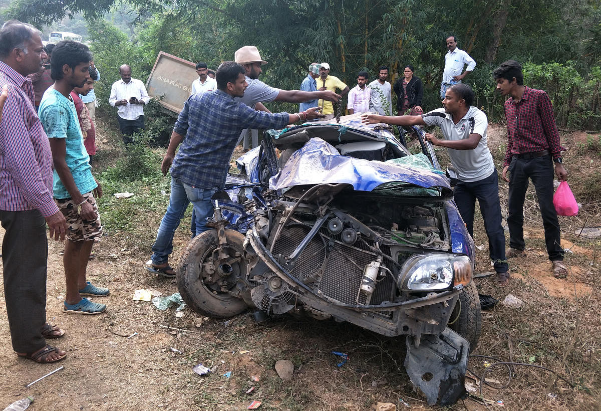 Mangled remains of the car involved in an accident on the Bengaluru-Mangaluru national highway near Donigal on Sunday.