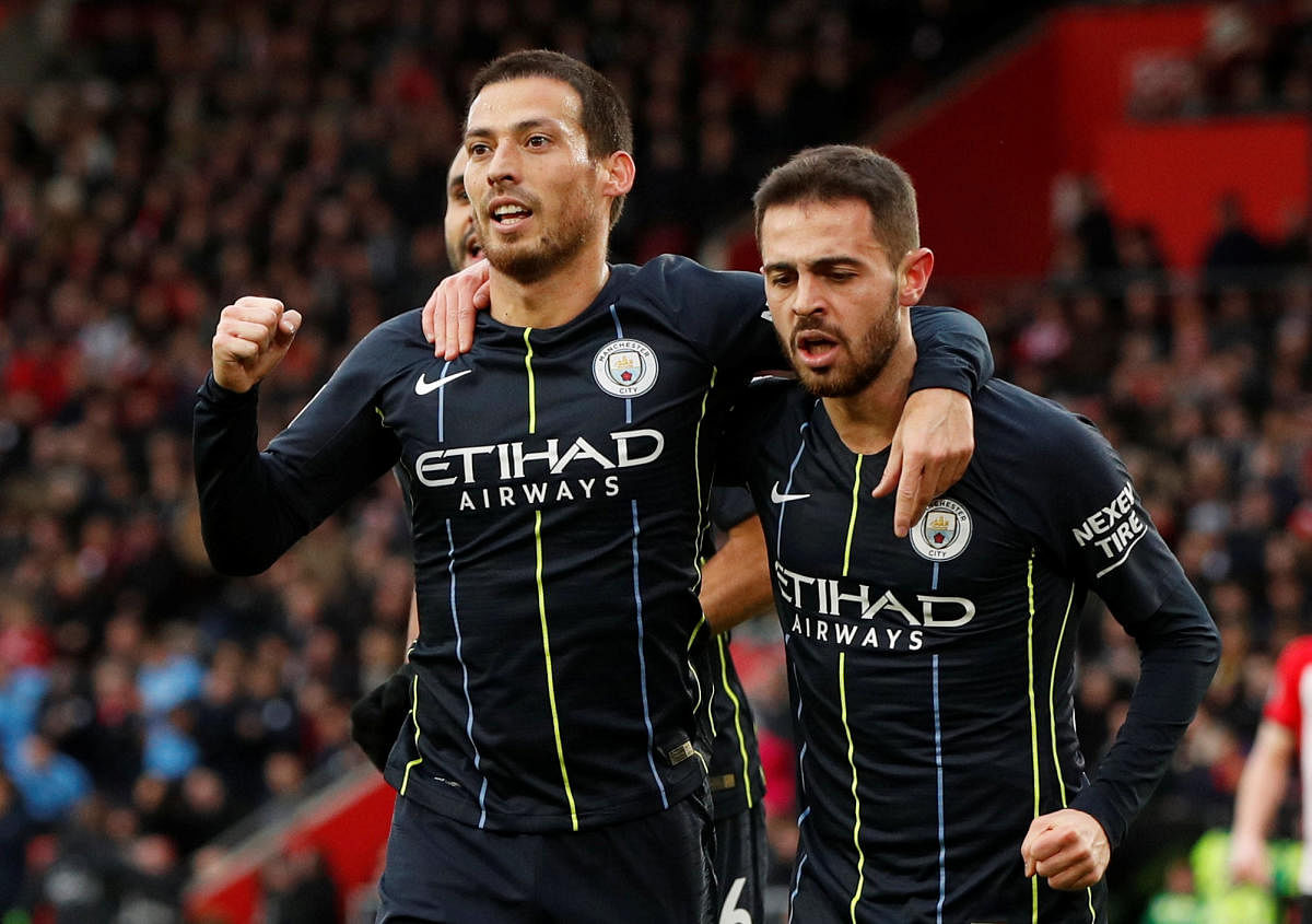 Manchester City's David Silva (left) celebrates with team-mate Bernardo Silva after scoring against Southampton on Sunday. Reuters