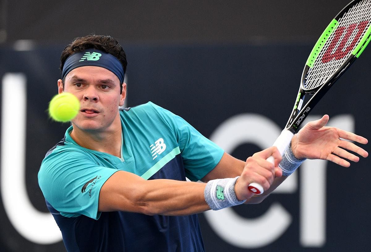 Canada's Milos Raonic hits a return during his win over Slovakia's Aljaz Bedene in the Brisbane International on Monday. AFP