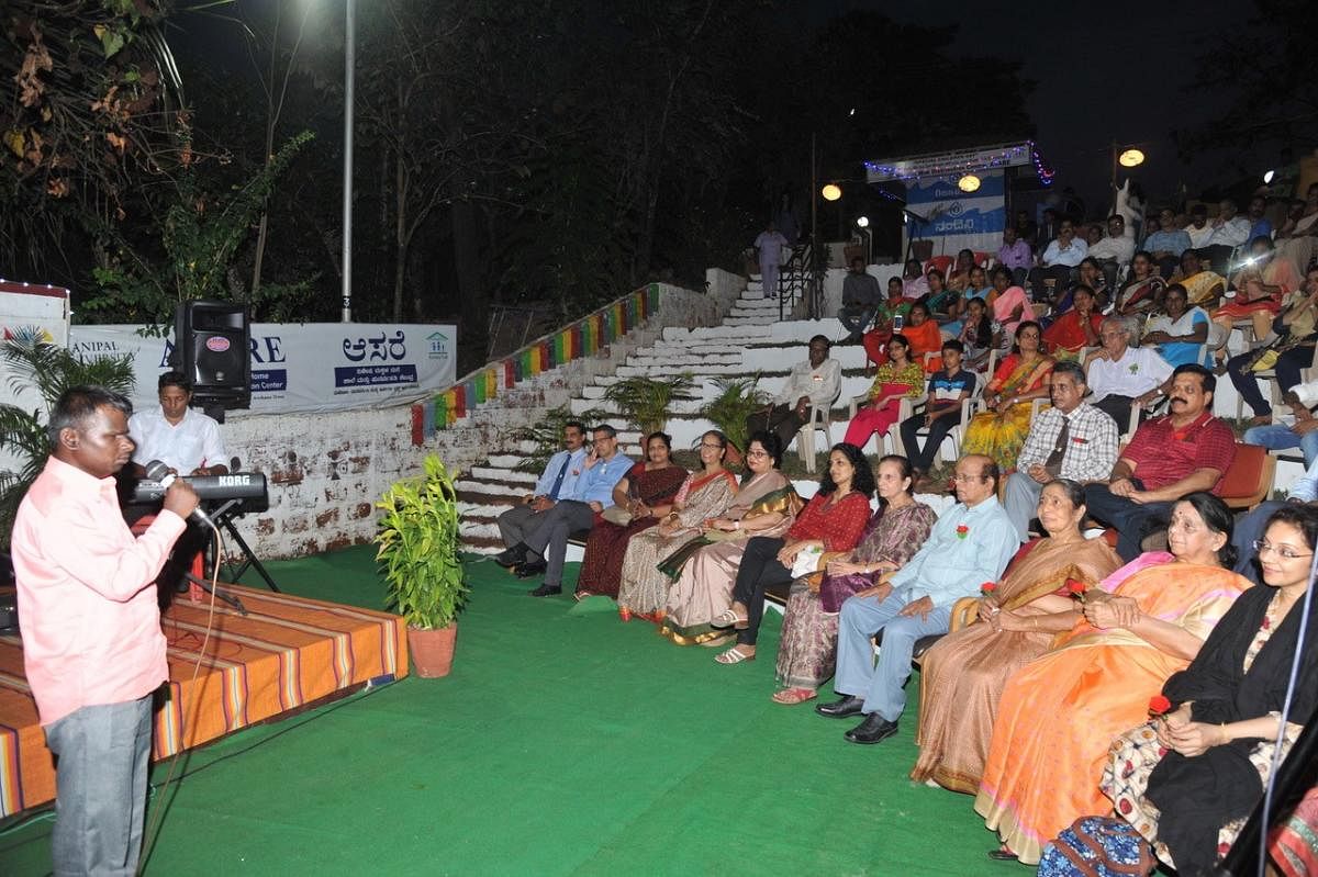 A visually impaired person performs during a musical evening in Manipal.