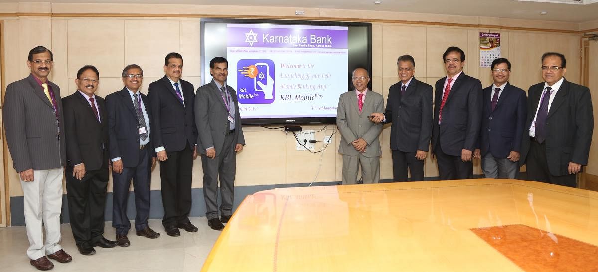 Karnataka Bank MD and CEO Mahabaleshwara M S, Non-executive Chairman P Jayaram Bhat and others at the launch of KBL Mobile Plus in Mangaluru on Tuesday.