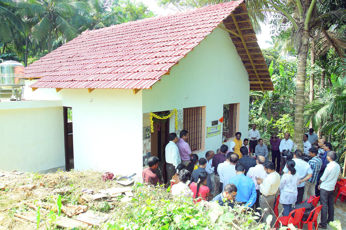 Suresh and his family at their new house in Kannur.
