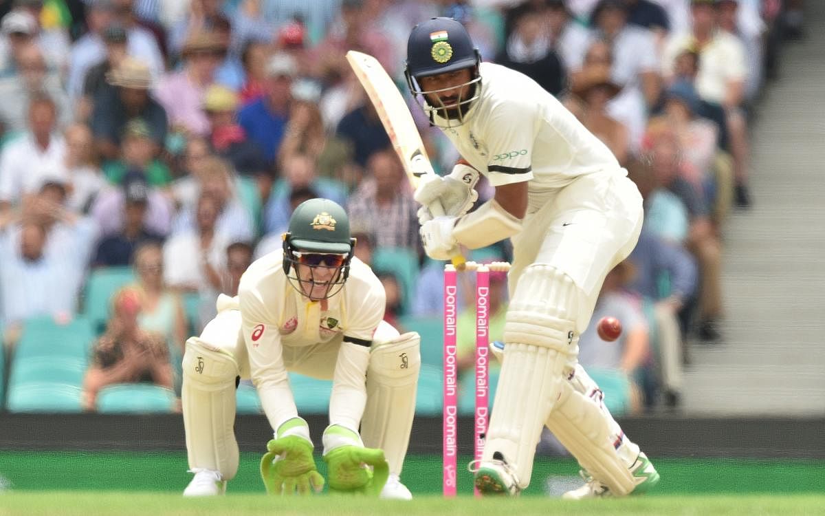 India batsman Cheteshwar Pujara hits a ball on the first day of the fourth and final Test against Australia at the Sydney Cricket Ground in Sydney on January 3, 2019. (AFP Photo)