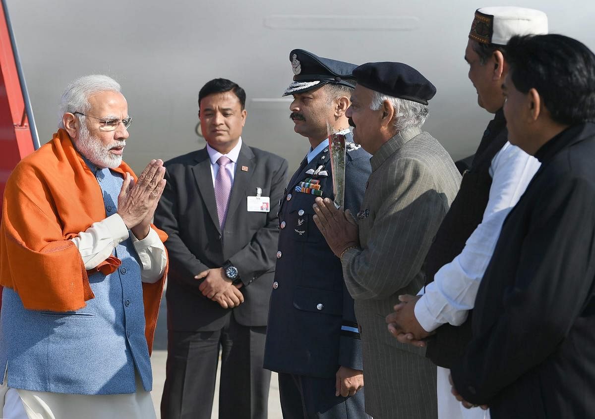 Prime Minister Narendra Modi being received by Punjab Governor VP Singh Badnore on his arrival, in Jalandhar. PTI photo