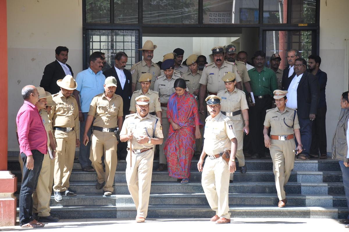 The accused in Sulvadi temple prasada poisoning case produced before the court, in Kollegal, on Thursday.