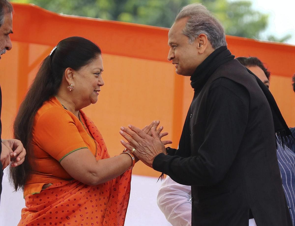 Rajasthan Chief Minister Ashok Gehlot and former chief minister Vasundhara Raje. (PTI Photo)