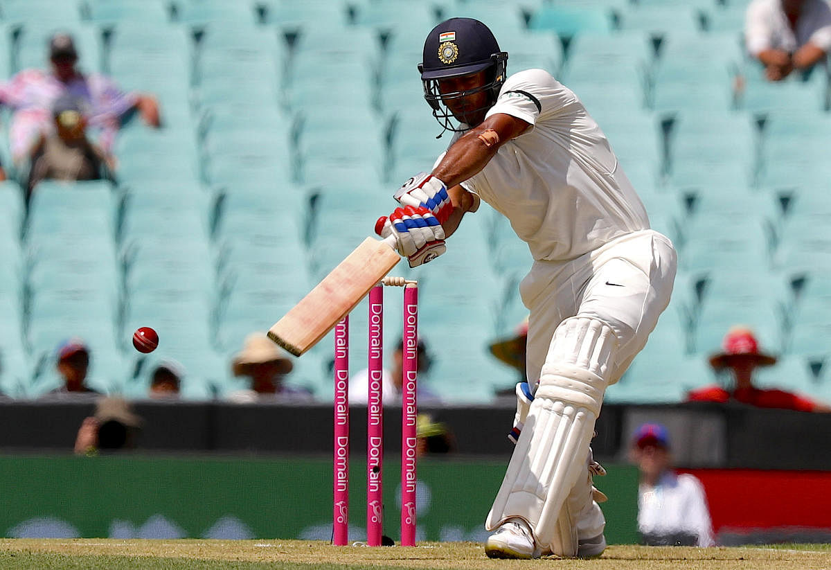 India's Mayank Agarwal hits a boundary during the first day of the fourth and final cricket Test against Australia at the Sydney Cricket Ground in Sydney on January 3, 2019. (AFP Photo)