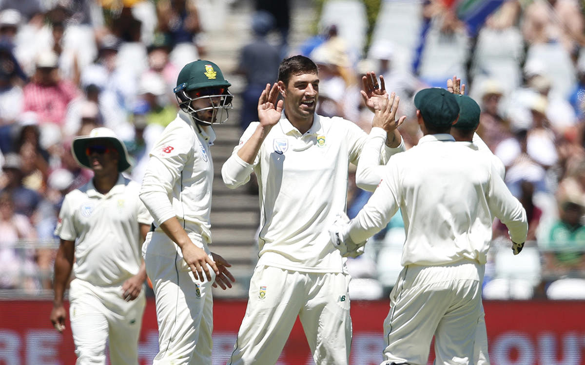 South African fast bowler Duanne Olivier (centre) celebrates the dismissal of Pakistan batsman Azhar Ali. AFP