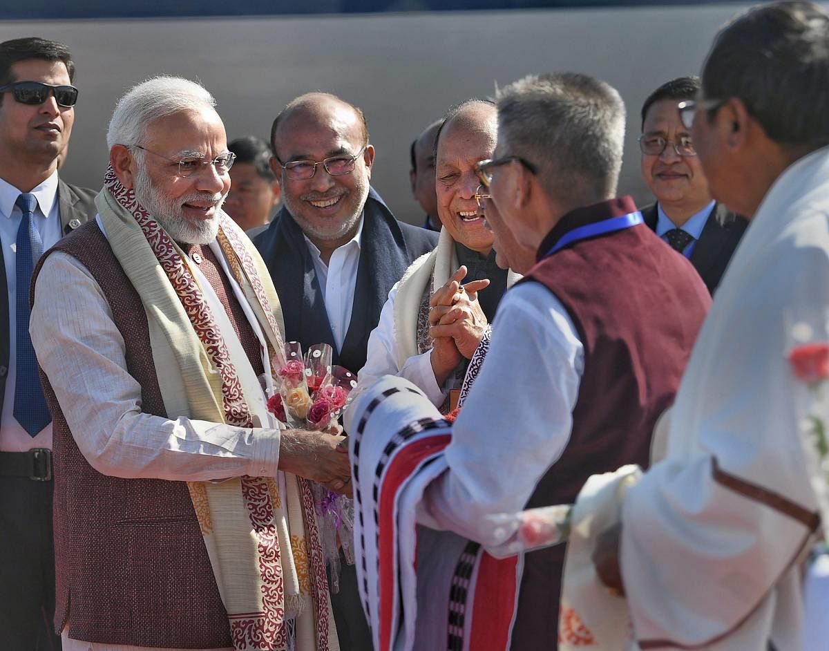 Prime Minister Narendra Modi being welcomed by the dignitaries on his arrival, in Imphal, Friday, Jan 4, 2019. (PIB Photo via PTI)