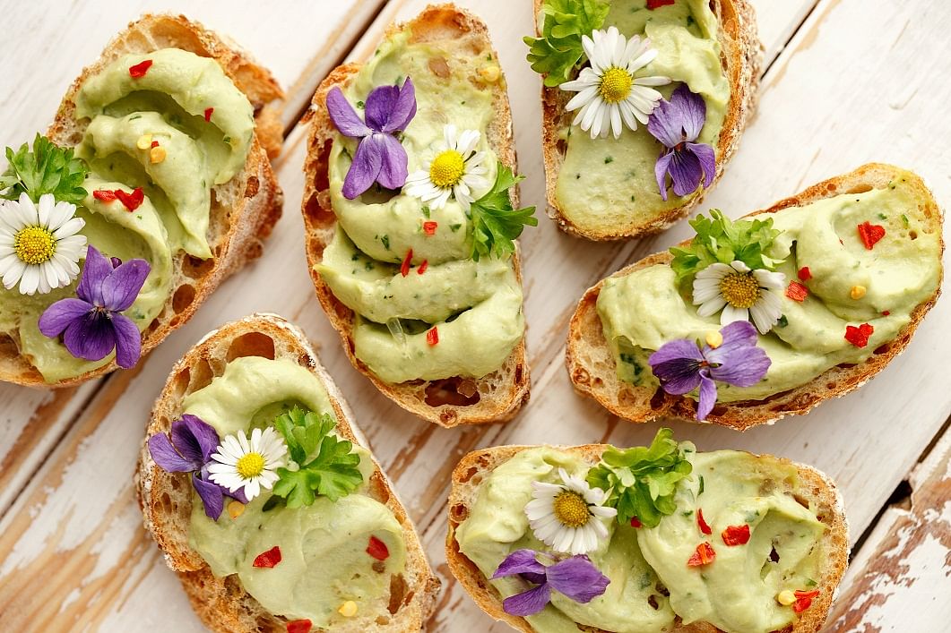 Avocado toast with a garnish of edible flower is a popular item.