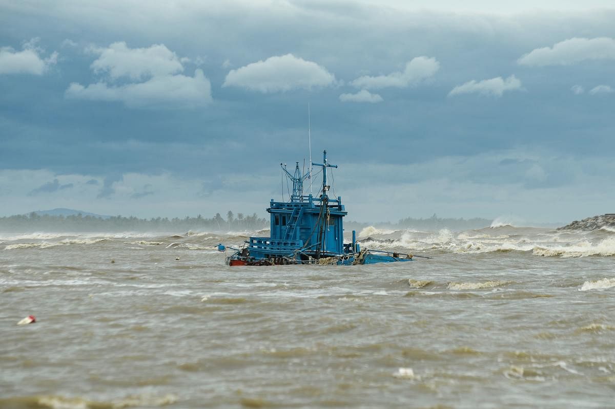 A fishing boat sinks because of high seas due to tropical storm Pabuk in the southern Thai province of Narathiwat on January 4, 2019. (AFP Photo)