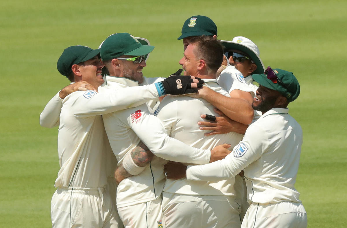 South Africa's Dale Steyn (centre) is mobbed by team-mates after dismissing Pakistan's Shan Masood on Saturday. REUTERS