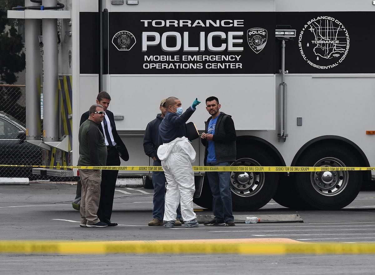 Police investigators work outside the Gable House Bowl center after 3 men were killed and 4 injured in a shooting at the bowling alley in Torrance, California, on January 5, 2019. (Photo by Mark RALSTON / AFP)