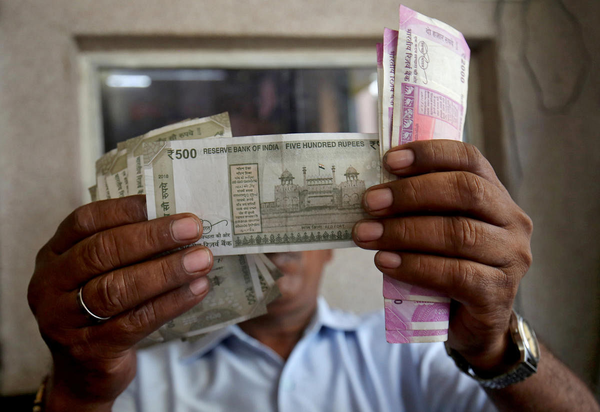 The rupee appreciated by 33 paise to 69.39 against the US dollar in opening trade Monday, driven by strong gains in domestic equities and weakening of the greenback in overseas markets. Reuters file photo