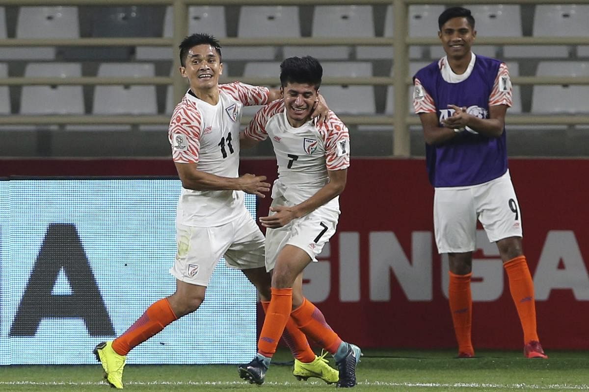 DREAM START: India's Sunil Chhetri (left) celebrates with Anirudh Thapa after scoring his second goal against Thailand on Sunday. AP/PTI