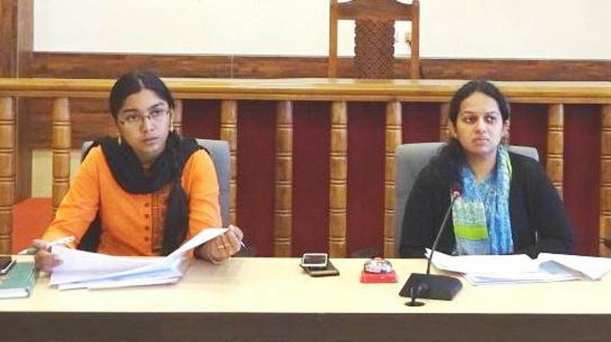 Deputy Commissioner P I Sreevidya chairs a meeting at her office on Monday. ZP CEO K Lakshmi Priya looks on.