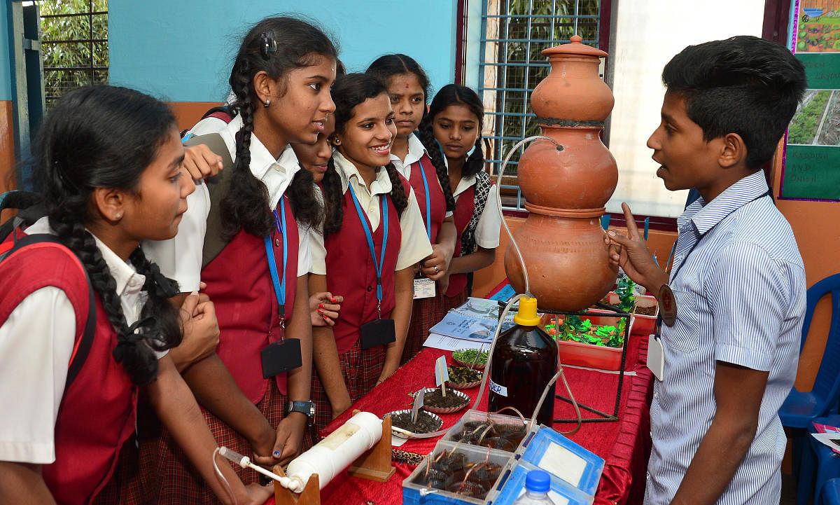 Sakthivel, from a government school in Puducherry, explains about biogas at the Southern India Science Fair held at St Joseph’s Indian High School on Monday. (DH Photos/Ranju P)