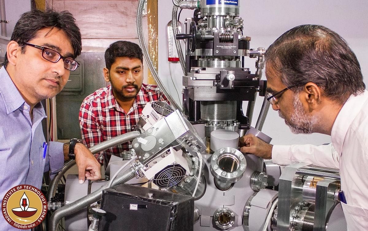 IIT Madras team-From left - Prof. Rajnish Kumar, Jyotirmoy Ghosh and Prof. Pradeep around their ultrahigh vacuum instrument