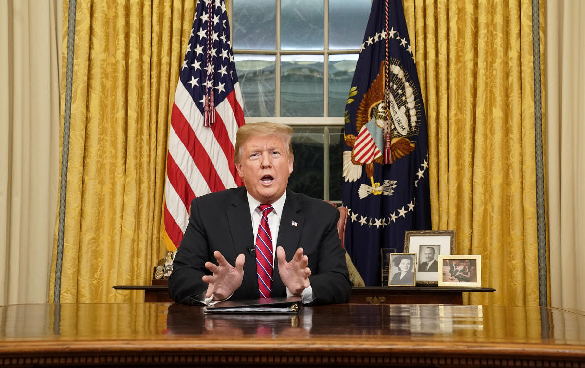 U.S. President Donald Trump delivers a televised address to the nation from his desk in the Oval Office about immigration and the southern U.S. border on the 18th day of a partial government shutdown at the White House in Washington, U.S., January 8, 2019