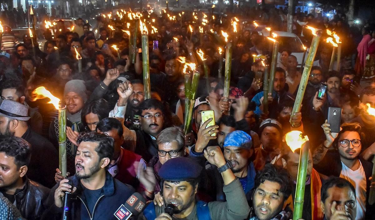 Activists participate in a torch light march in protest against Citizenship (Amendment) Bill, 2016, in Guwahati, Wednesday, Jan 9, 2019. (PTI Photo)