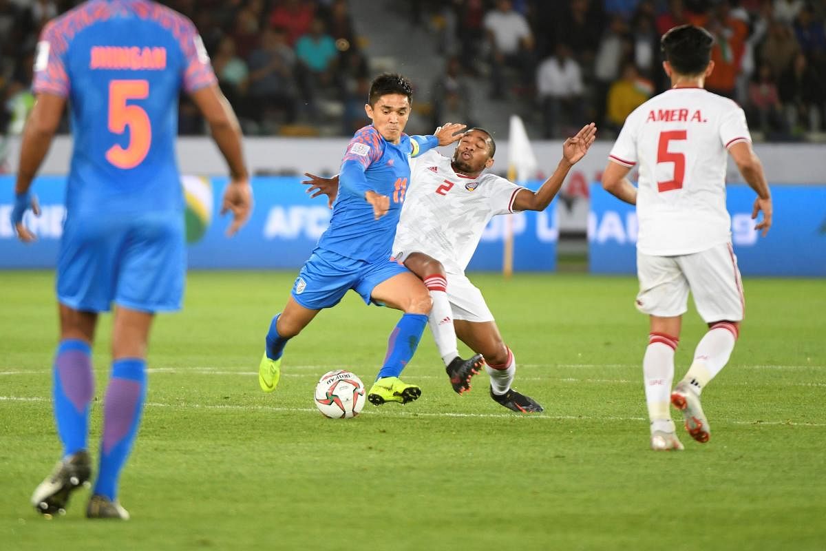 India's forward Sunil Chhetri (C-L) vies for the ball with United Arab Emirates' midfielder Ali Salmeen during the 2019 AFC Asian Cup group A football match between India and UAE at Zayed Sports City stadium in Abu Dhabi. AFP Photo 