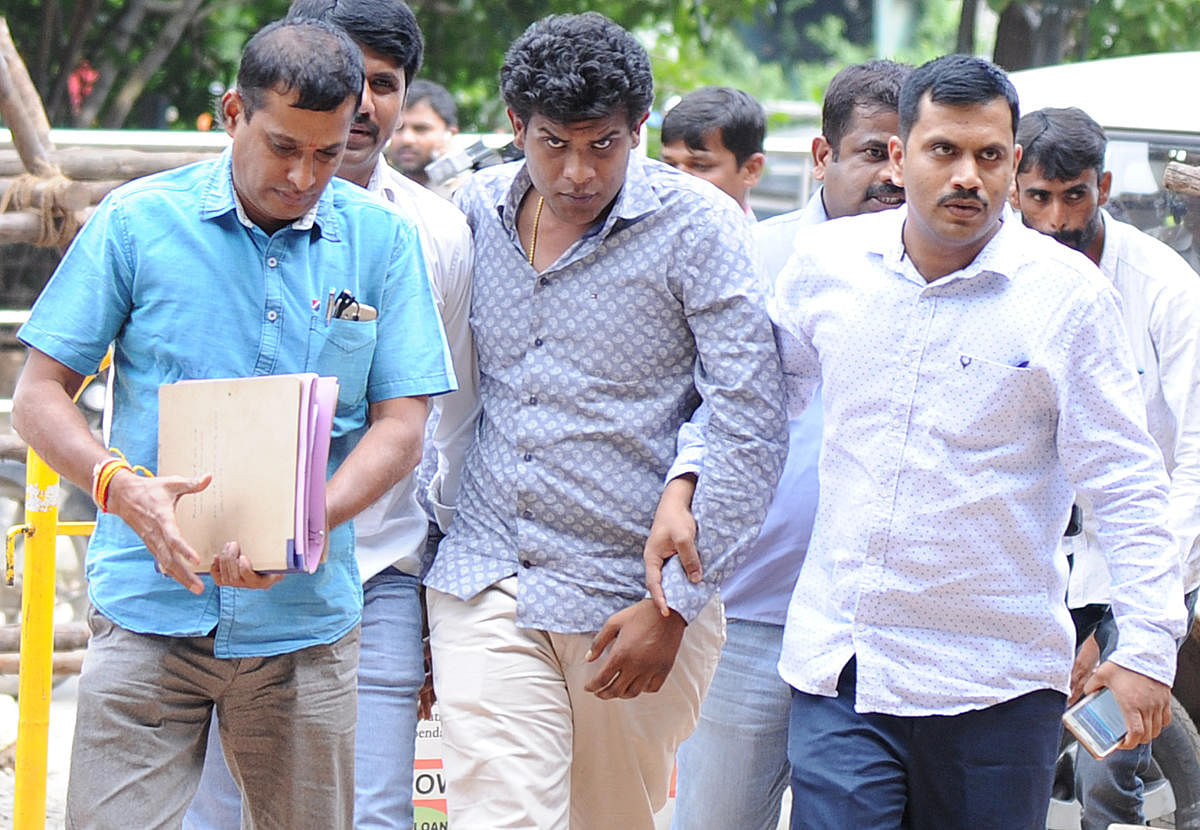  Geetha Vishnu (centre) being produced at a court in 2017. DH file photo