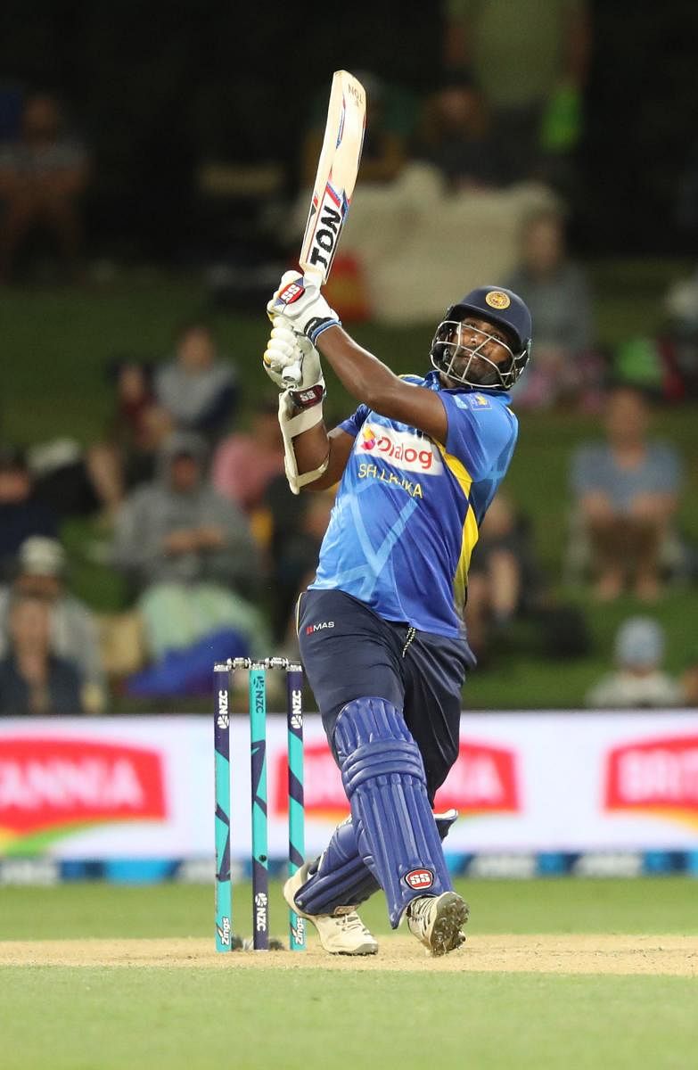 Sri Lanka's Thisara Perera clobbers one to the boundary during his blistering century against New Zealand on Saturday. AFP