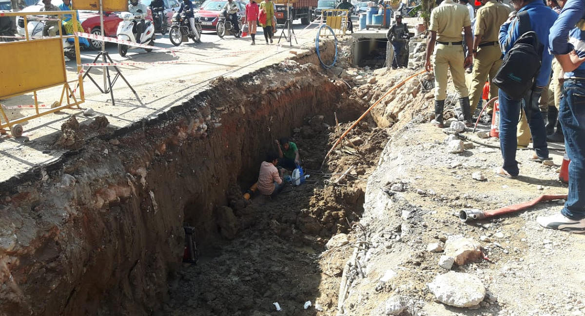 GAIL workers repair the damaged gas pipeline near Wipro Corporate Office on Sarjapur Road in Bengaluru on Friday. 