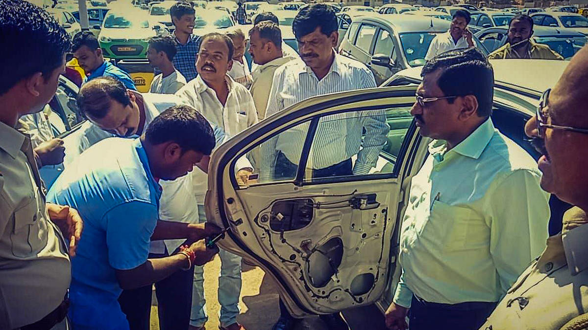 RTO officials remove the child lock system from a cab during a special drive.