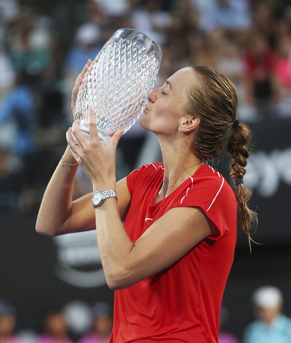 Petra Kvitova of the Czech Republic kisses the trophy after beating Ashleigh Barty of Australia in the final of the Sydney International tournament. AP/PTI