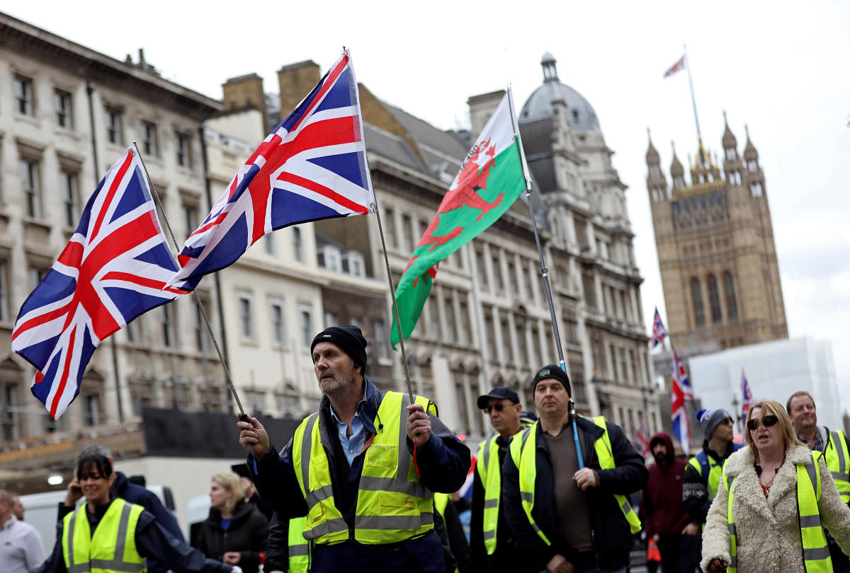 Protesters wearing yellow vests participate in a pro-Brexit demonstration march in central London. Reuters