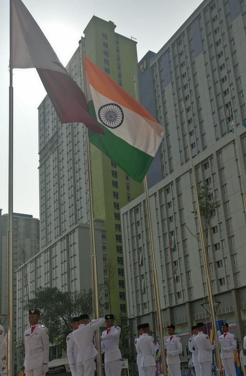 Indian flag being hoisted at the Asian Games' village in Jakarta. DH PHOTO