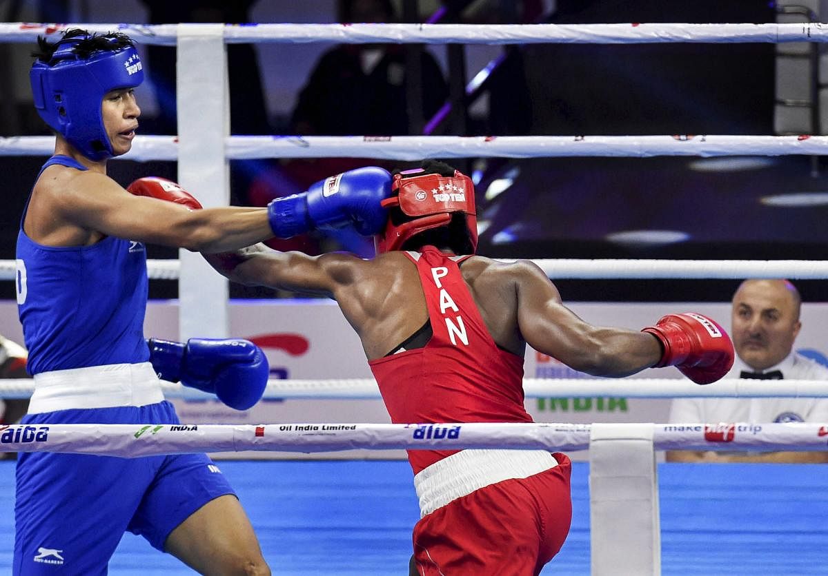 India's Lovlina Borgohain (left) land a blow on Atheyna Bylon of Panama during the 69 kg pre-quarterfinal bout on Sunday. PTI