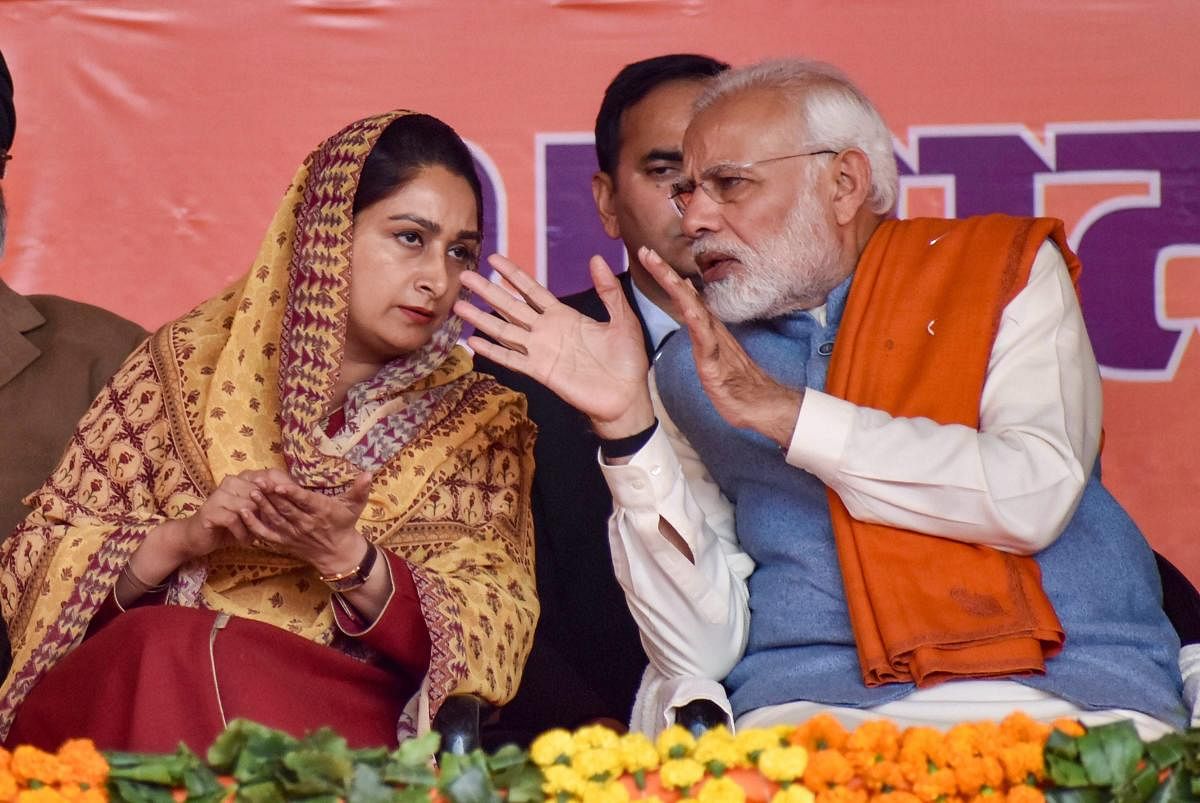 Prime Minister Narendra Modi with Union minister and SAD leader Harsimrat Kaur Badal during the ‘Dhanwad Rally’ at the PUDA ground in Gurdaspur on Thursday. PTI