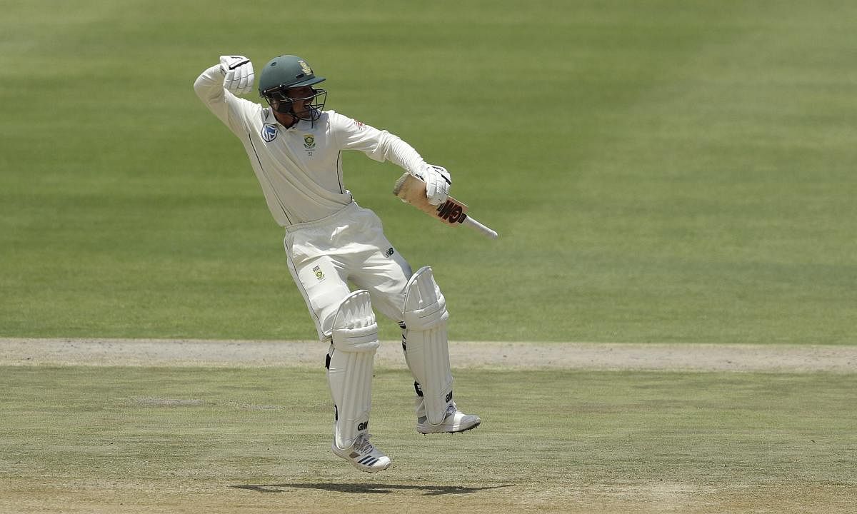  South Africa's Quinton de Kock celebrates his century on day three of the third Test against  Pakistan in Johannesburg on Sunday. AP/PTI