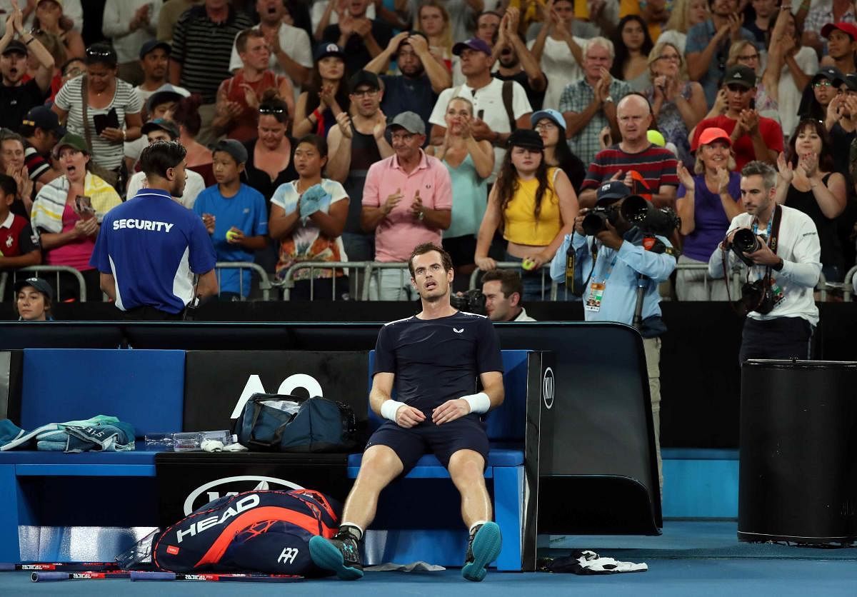 Andy Murray looks dejected after losing the match against Spain's Roberto Bautista Agut. Reuters